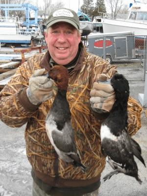 Bluebills & Redheads Our good buddy Todd Wagner (Pa) holds a bull Redhead and Greater Scaup.  While we do not target these birds daily (small limits)-our region is one of the few areas in North America where lesser and greater Scaup (Bluebills) congregate during the fall migration.  When the right opportunity arises, the Seaway team is fully rigged to take advantage of these legendary diving ducks.  Todd and his brother Judd gunned beautiful examples of both lesser and greater drakes with this drake Redhead thrown in the mix as icing on the cake